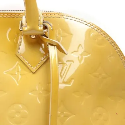 Louis Vuitton Alma Monogram Handbag